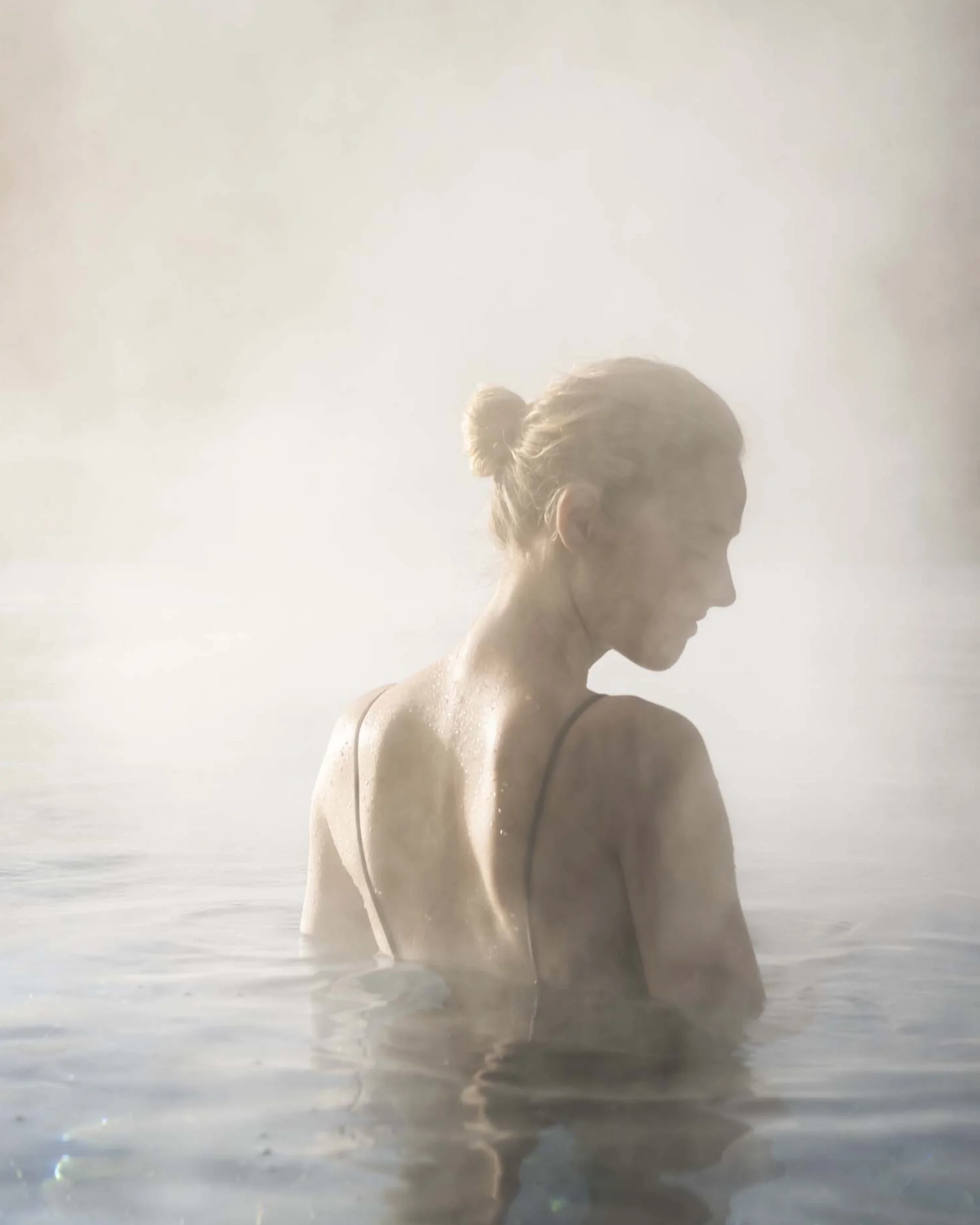 A hideaway for your exclusive holiday in Val Pusteria/Pustertal Woman in warm steaming water with misty mountains in the background