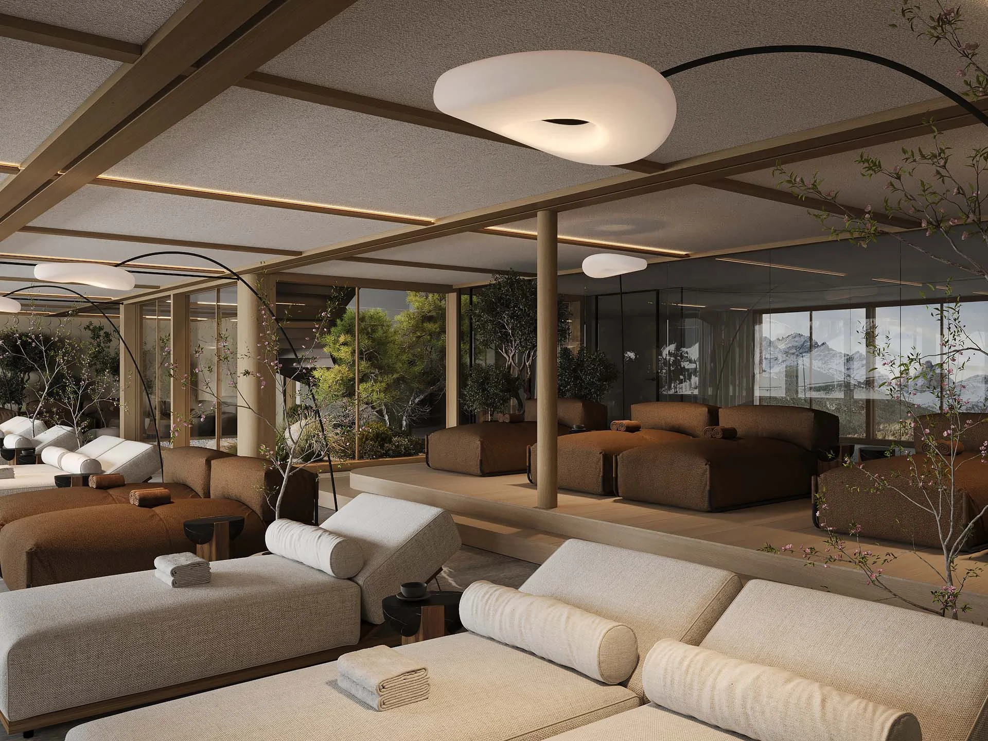 Hotel Monika: soothing day spa in Val Pusteria/Pustertal valley Modern relaxation room with loungers and large windows showing mountain views