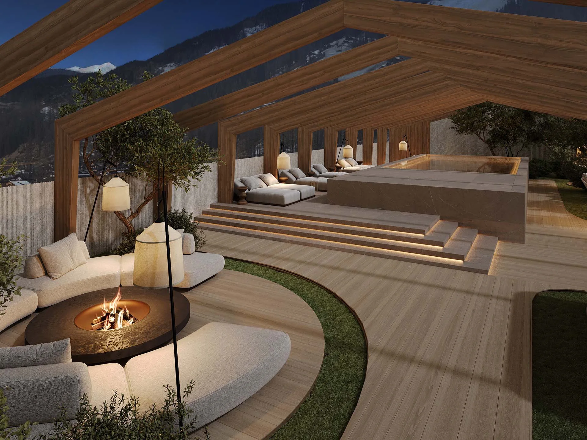 Hotel Monika: soothing day spa in Val Pusteria/Pustertal valley Modern outdoor area with fire pit, loungers, and wooden structure at night