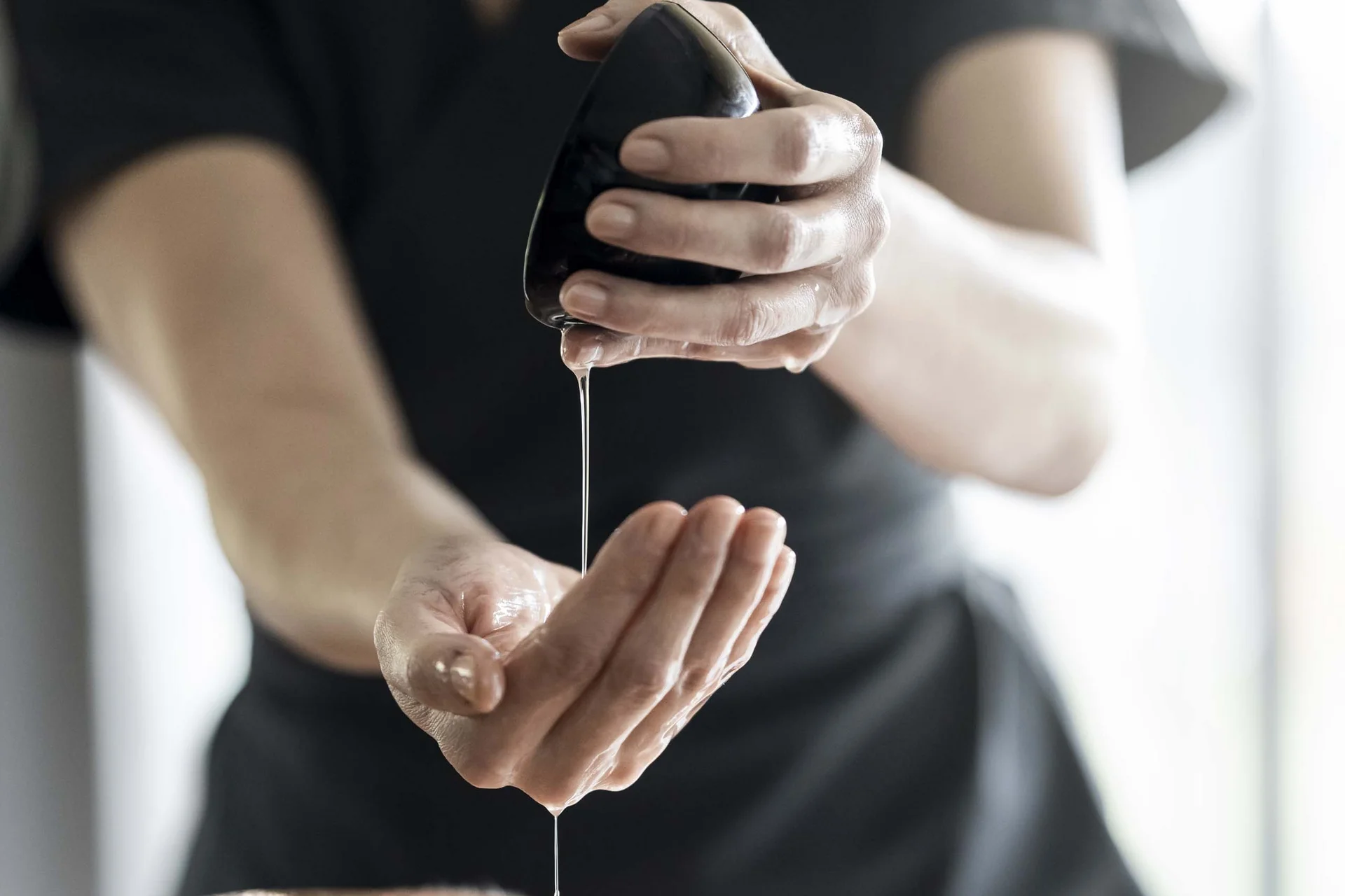 Vacancies at Hotel Monika Man receiving massage with oil dripping from a stone